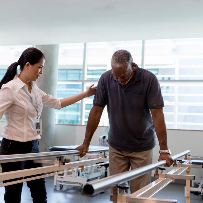man rehabilitating exercise with professional
